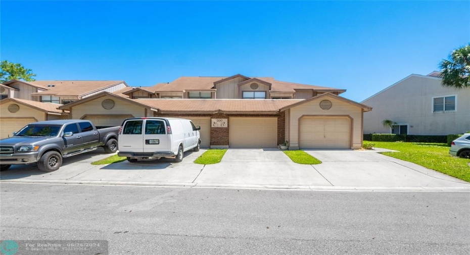 Front of the Building. Garage is 2nd from right to left