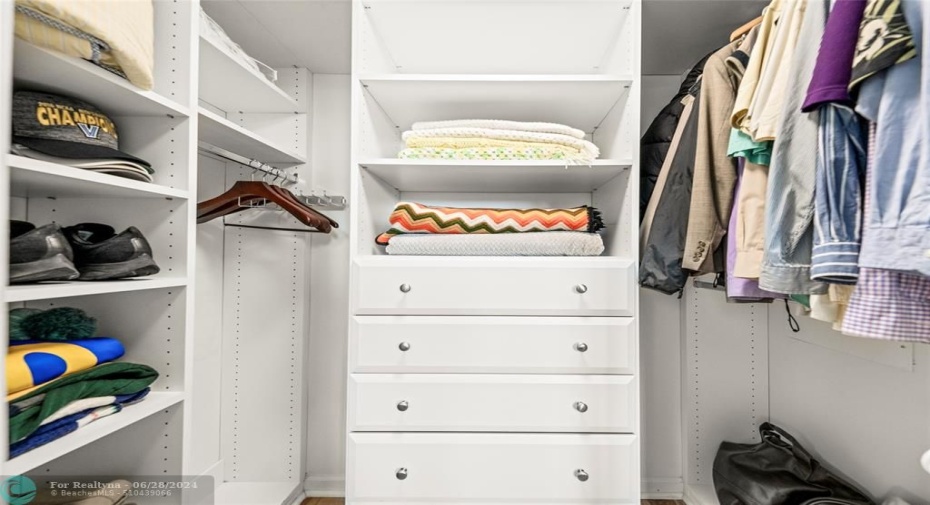 Primary Bedroom Walk-In Closet with Cabinetry