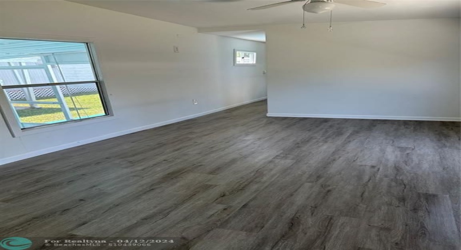 View of hallway to bedrooms and window overlooking Florida Room.