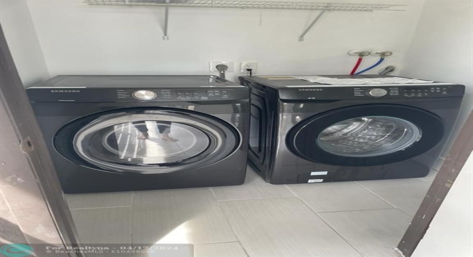 Laundry room - Samsung full size washer and dryer