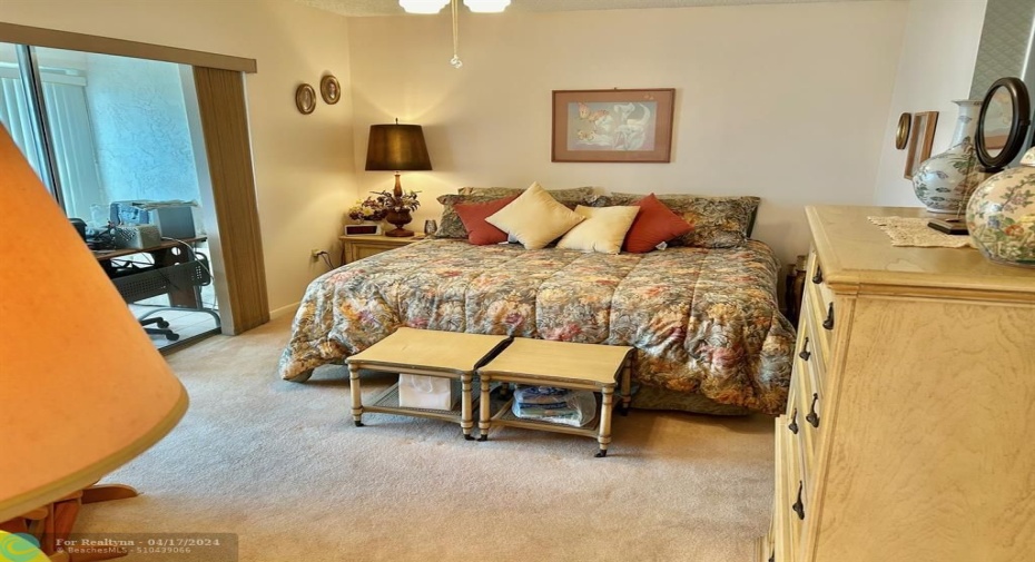 PRIMARY BEDROOM IS A GREAT SIZE AND EXITS TO AN ENCLOSED PATIO.