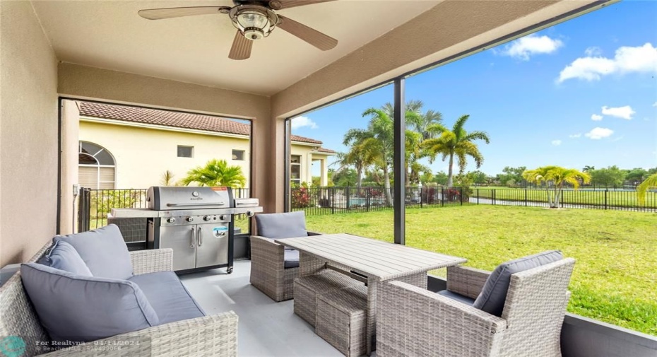 Screened in, covered patio with ceiling fan