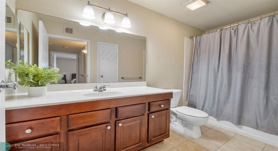 Large primary bathroom with updated cabinetry!