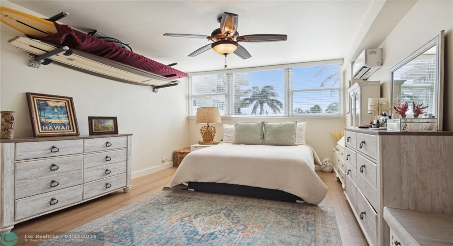 Spacious bedroom with walk in closet for storage.