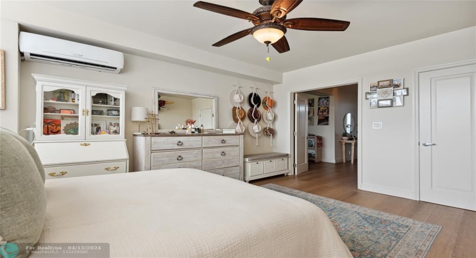 Spacious bedroom with walk in closet for storage.