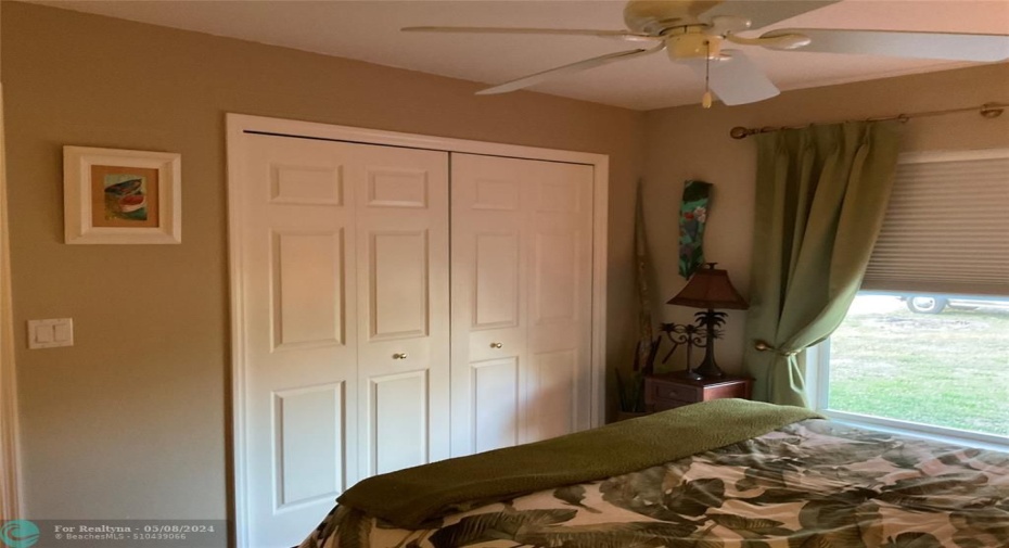 Bedroom two with built in closet and large window