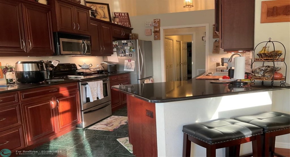 Breakfast nook off kitchen with beautiful windows overlooking garden area