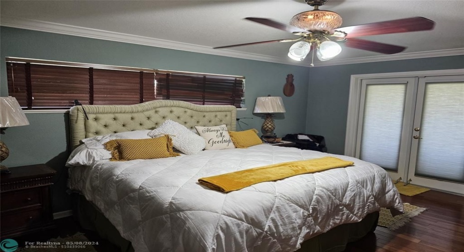 Master bedroom ceiling fan and French doors to Lania and Hot Tub