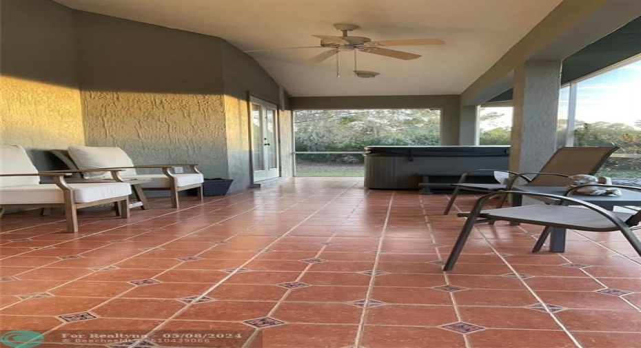 Lanai with Spanish tile floors,new screens and hot tub