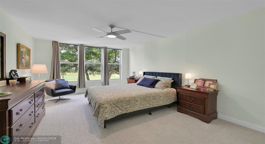 Primary bedroon could welcome a king size bed.  Wake up to a view of the golf course