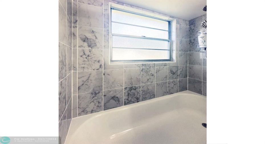 Beautiful Tile Surrounds this Window within the Shower/Tub.