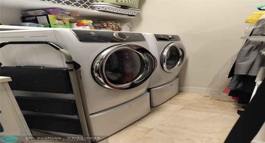 Front Load Washer and Gas Dryer on Pedestals