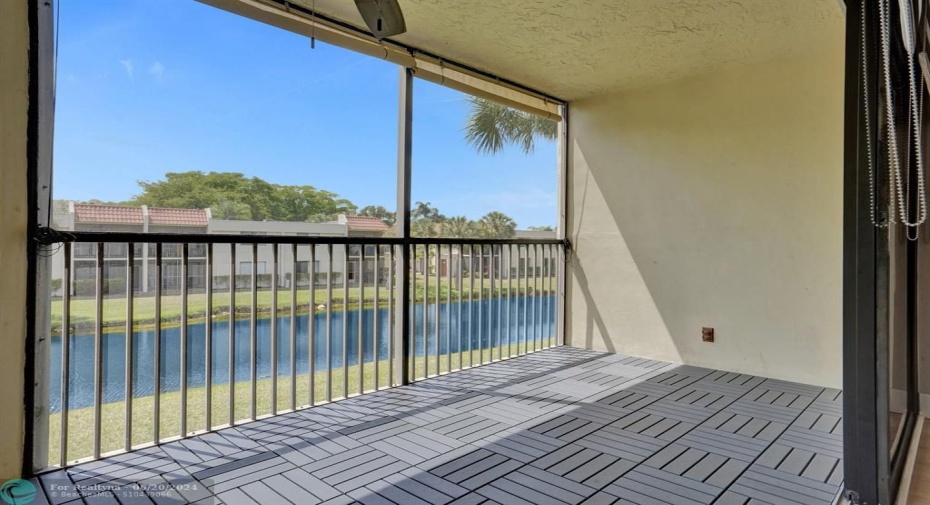 Huge covered and screened patio overlooking the water