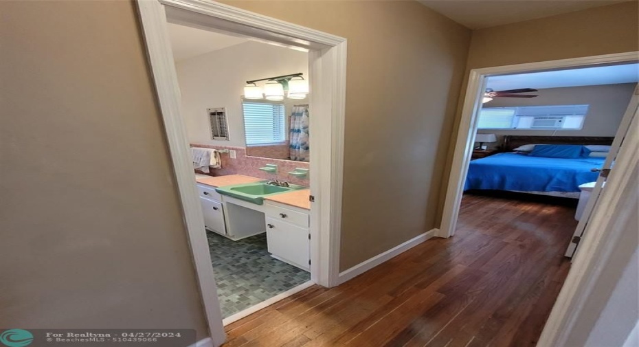 Hallway from kitchen leads to bedrooms and master bath