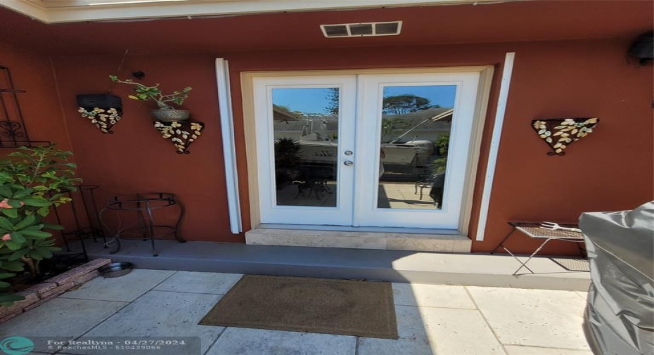 Patio with pre-cast stone tile, wired for speaker hook-up outside for entertaining (BBQ grill conveys)