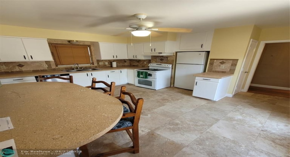 Kitchen (saturno marble flooring & sand/seashell concrete countertops)