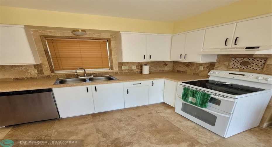 Kitchen (saturno marble flooring & sand/seashell concrete countertops)