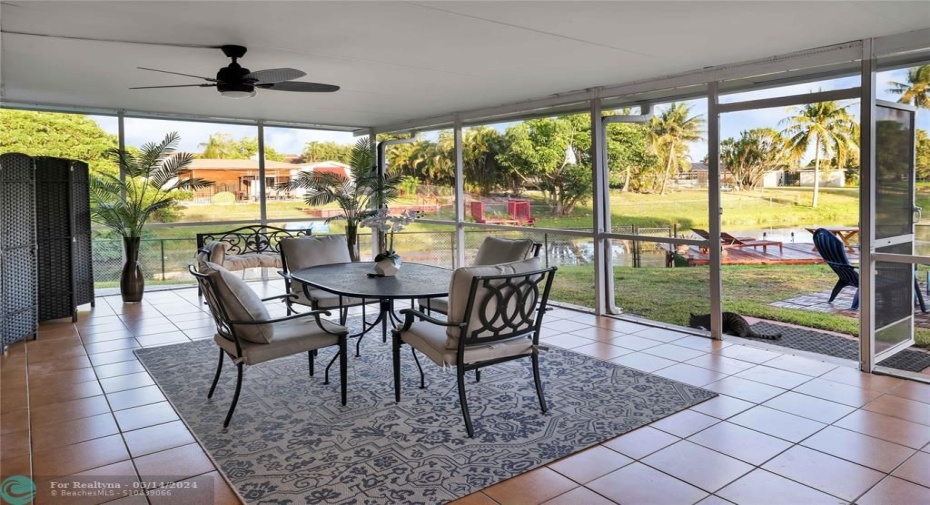 Enjoy Screened-In, waterside dining and living space on this oversized patio!