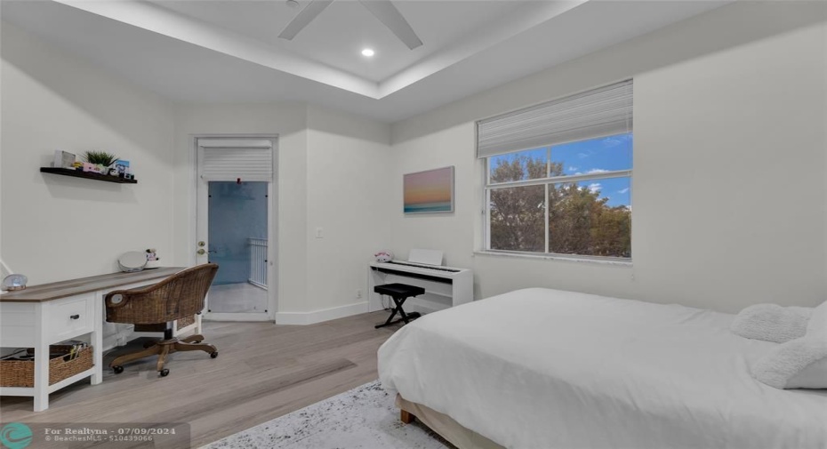 Third Bedroom offers raised ceiling and French door to private balcony