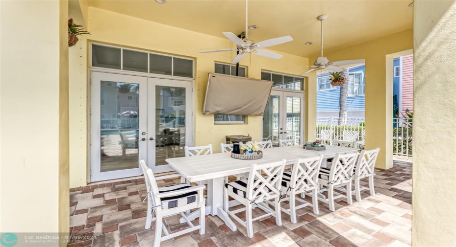 Covered patio for dining and offers outdoor television