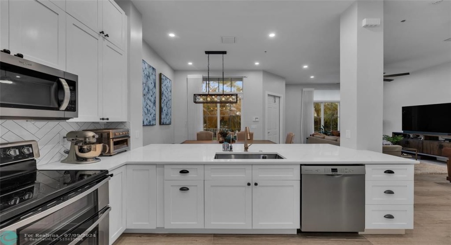 White subway tile and white shaker kitchen offers the perfect bright and cheery kitchen to cook and entertain