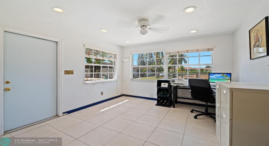 12X11 ROOM OPEN TO KITCHEN WITH DOOR TO FRONT AREA