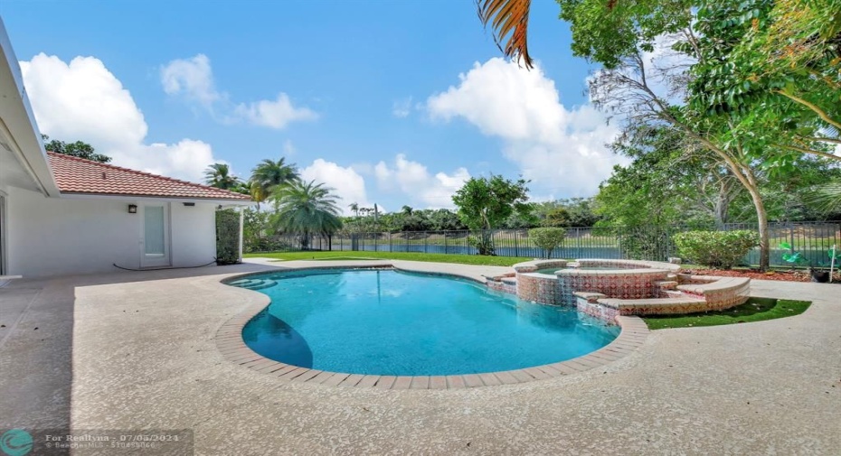 Pool with raised spa, expansive lawn with berm, no neighbors behind!