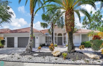 WELCOME TO PALM ISLAND, A PRESTIGIOUS BOUTQUE ENCLAVE OF CUSTOM HOMES IN THE HEART OF WESTON! NEWLY REMODELED WITH A CONTEMPORARY FLAIR, THIS 5+DEN, 4.5BA, 3CG LAKEFRONT HOME W/POOL/SPA SHOWS LIKE A MODEL!