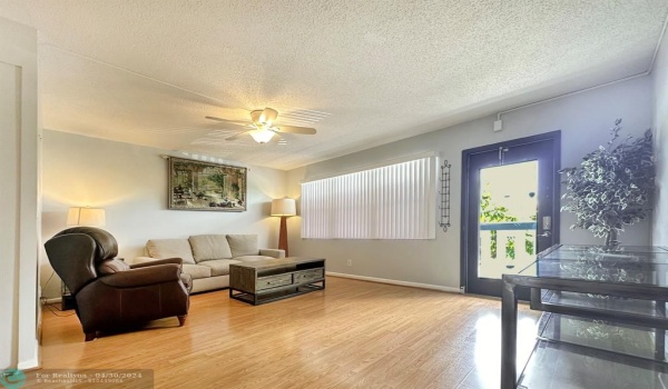 Entrance Into Living Area w/ Hurricane Door Letting in Sunlight!