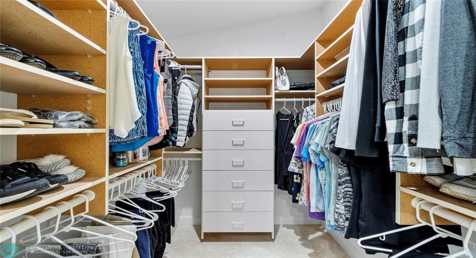 WALK IN CLOSET WITH BUILT INS SEPARATE FROM OTHER WALK IN CLOSET