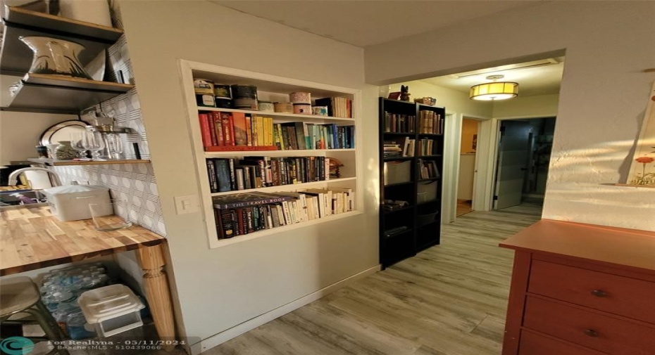 Hallway leading to bedrooms (3 to 1 split bedroom floor plan)