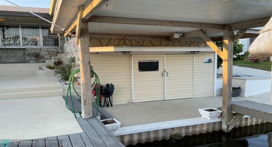 Boat house storage under sunroom