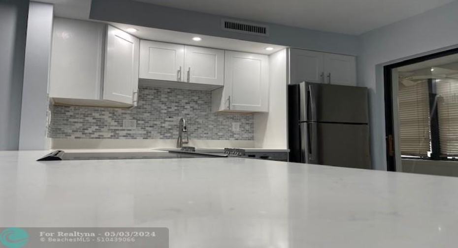 kitchen counter and marble backsplash