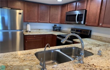 Beautiful open concept kitchen granite countertops and all wood cabinets.