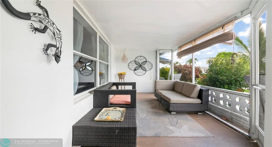 Nestled at the front of the house, the screened patio creates a cozy and peaceful retreat, inviting you to relax and unwind surrounded by nature