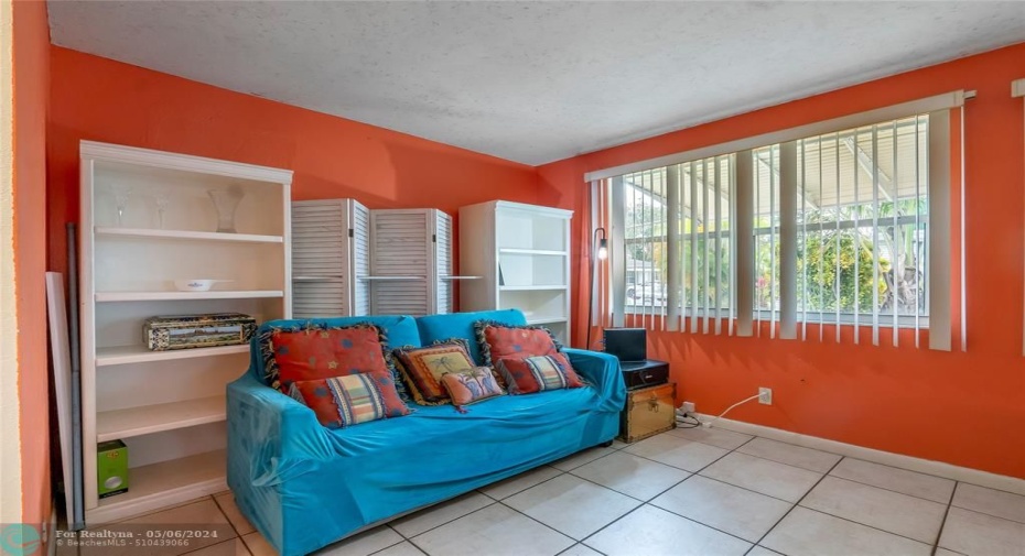 The Florida Room, spacious enough to accommodate a couch for extra company or for watching TV, can also be easily converted into a third bedroom