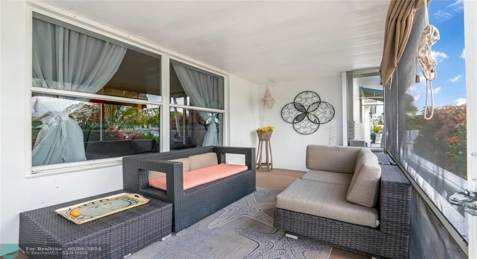 There is a screened patio at the front of the house offers a tranquil space to enjoy the outdoors while maintaining privacy and protection from insects
