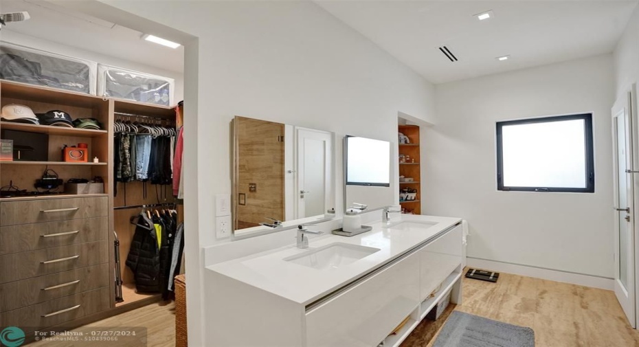 Double closet, toilet and rainfall showers.