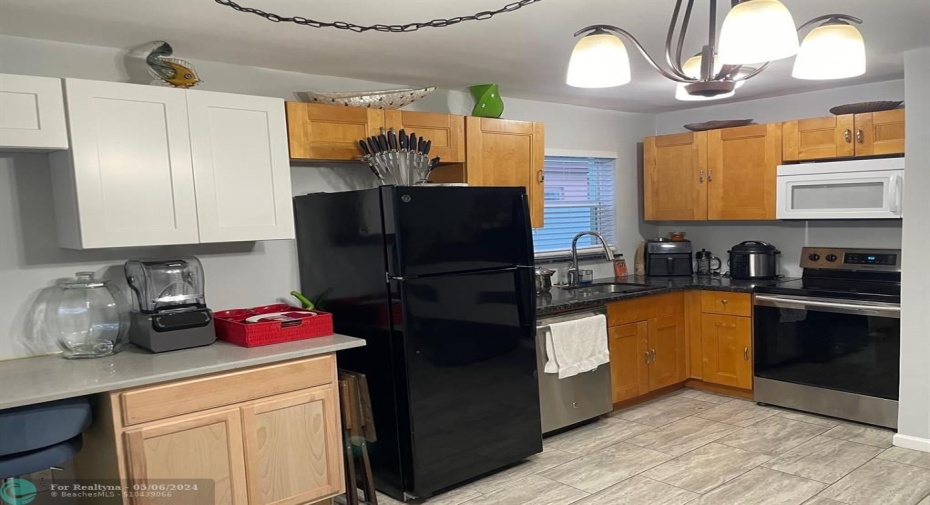 Lots of cabinet space, Refrigerator, Dishwasher, range and Microwave!