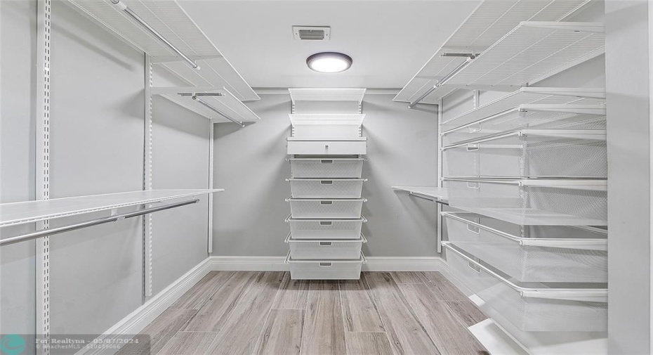 Huge Walk-in Master Closet with Built ins
