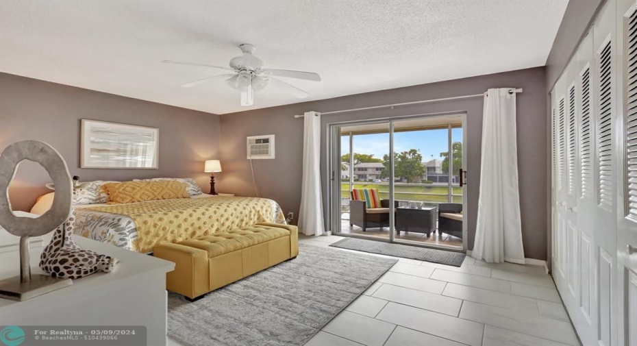 TASTEFULLY DECORATED AND FURNISHED BEDROOM WITH VIEW ON THE FLORIDA ROOM
