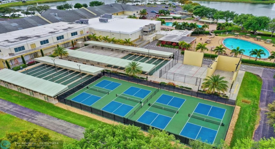 VIEW OF THE TENNIS COURTS AND ALL ACTIVITIES AT THE CLUBHOUSE