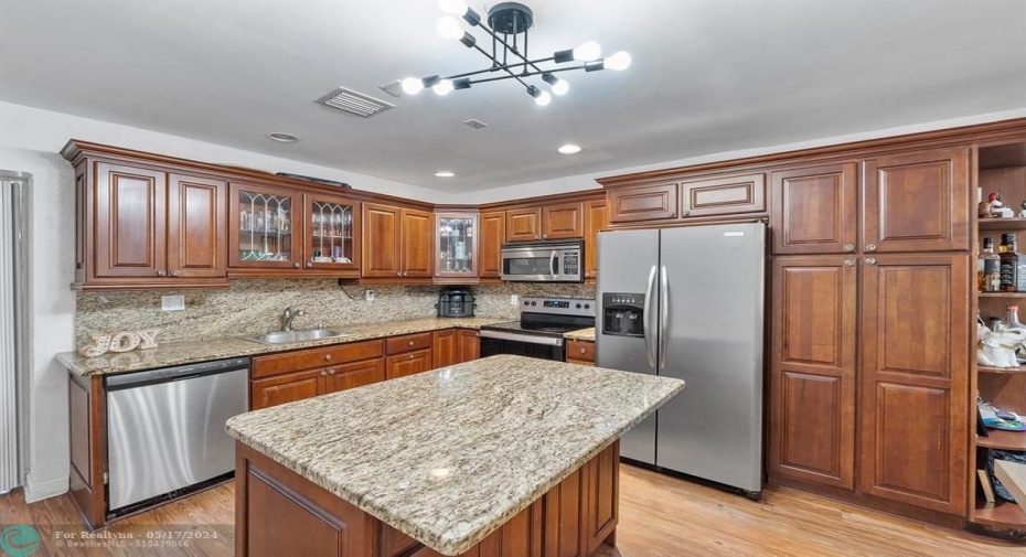 Granite counters and stainless steel appliances round off this updated kitchen!