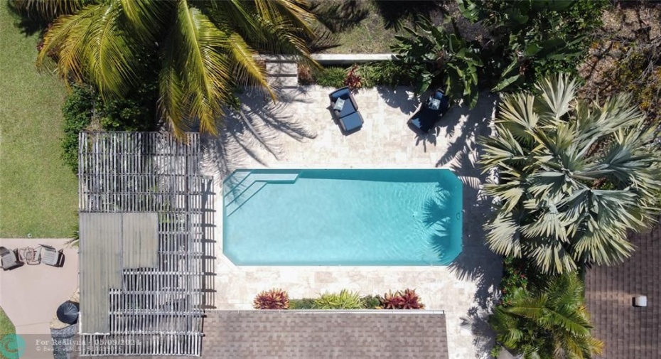Aerial of the spacious backyard, paver patio and pool
