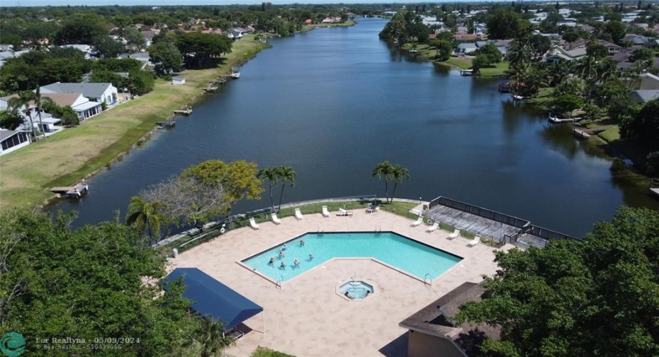 Aerial view of the community pool and spa overlooking Lake Nona