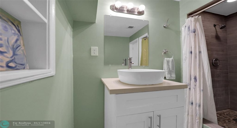 2ND BATHROOM W/ NEWER VANITY, TOILETTE AND BEAUTIFULLY DESIGNED SHOWER!