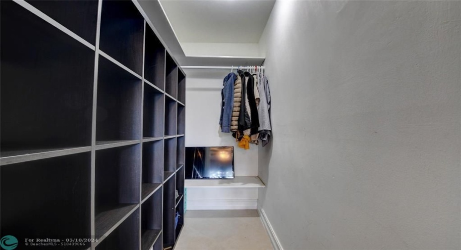 Huge built-in walking closet in master bedroom