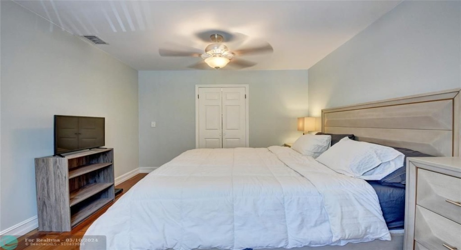 Spacious Second Bedroom with wood floors and newer fan