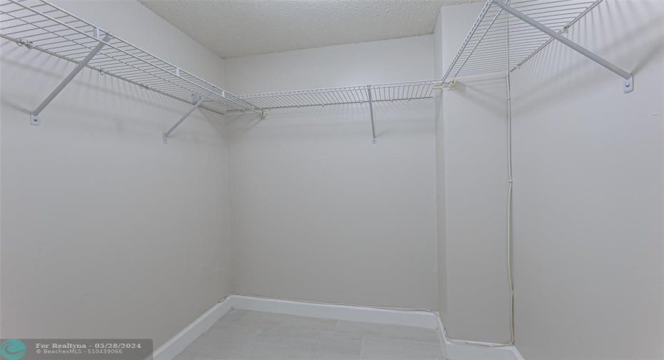 Large walk in closet in addition to wall closet in master bedroom