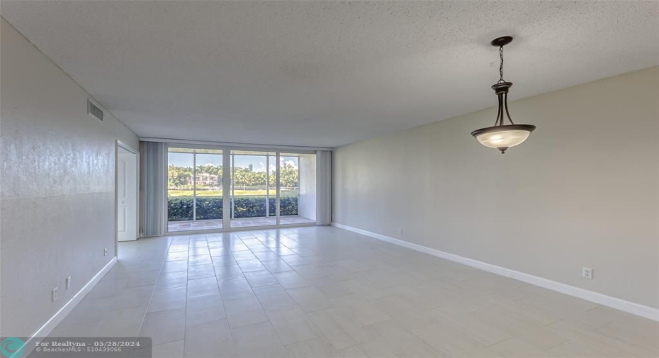 Large and spacious living room located on the desirable 1st floor with views of the Intracoastal and green space